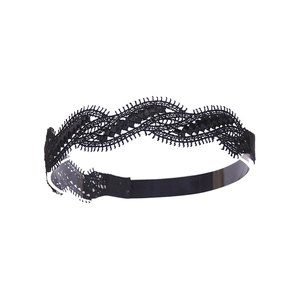 Detail view of black hollow lace headband with intricate floral embroidery patterns