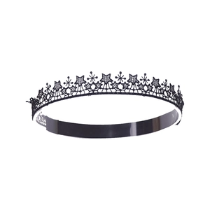 Detailed view of black lace headband with intricate star patterns and embroidered texture