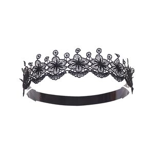 Detailed view of black lace choker with floral embroidery and satin ribbon base