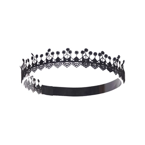 Detail of black lace embroidery choker with crown pattern and delicate geometric waves
