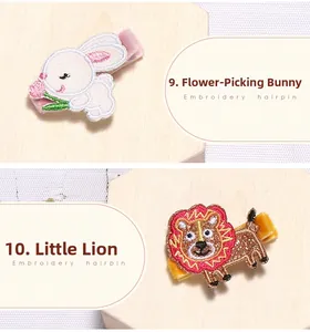 Détails des barrettes brodées lapin et lion avec texture en ruban de velours