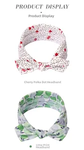 Close-up of baby headbands with cherry polka dot and lime fruit patterns on white background