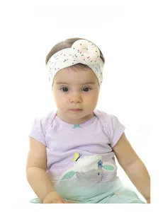 Three-piece set of stretchy baby headbands featuring pink floral patterns and donut 3D bows