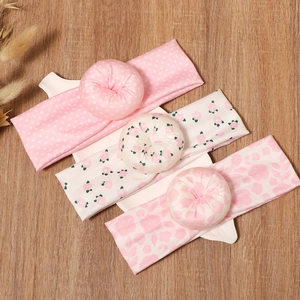 Set of 3 elastic baby headbands with donut bows in assorted pink floral patterns