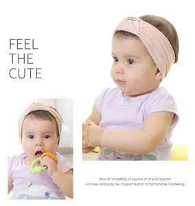 Detail of soft striped knit baby headbands with a cute knot bow design for infants