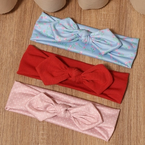 Three-pack cute floral and polka dot baby bow headbands in blue, red and pink