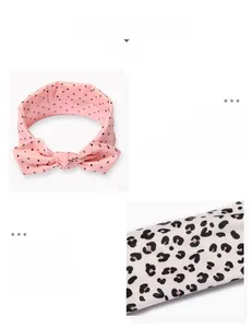 Nahaufnahme von Baby-Stirnbändern mit Herz- und Leopardenprint aus weichem Elastikstoff