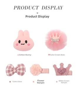 Detail view of 5-piece pink rabbit and crown hair clip set for kids with mesh and lace