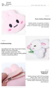 Detail of plush bunny hair clips featuring mesh crown and soft non-slip cotton fabric