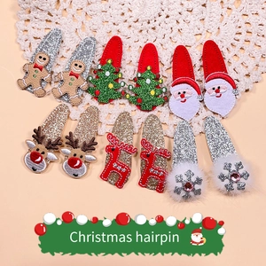 Detailed view of 12-piece Christmas hair clips featuring gingerbread and reindeer designs