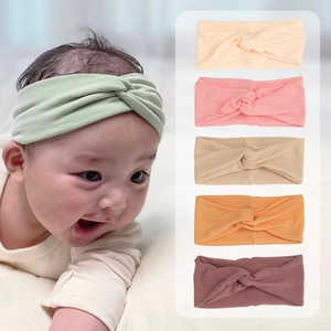 Close-up of ribbed texture and knot detail on assorted color baby headbands