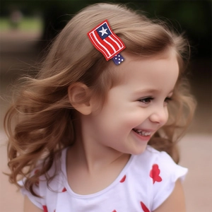 Close-up of a child wearing a patriotic American flag embroidered hair clip outdoors