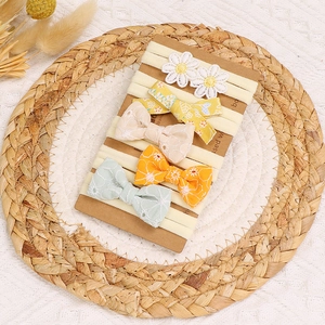Lot de 5 bandeaux bébé avec nœuds brodés et motifs floraux sur nylon élastique