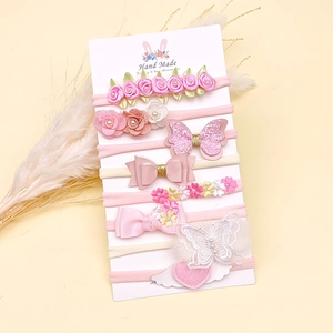 Detail von 8-teiliges Baby-Stirnband-Set mit Seidenblumen und Schleifen aus Pailletten