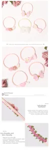 Detail von weichen Nylon-Baby-Stirnbändern mit rosa Schleife, Schmetterling und Blumen