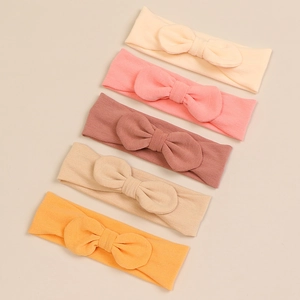 Set of 5 soft modal bow headbands for baby girls in warm neutral and pastel colors