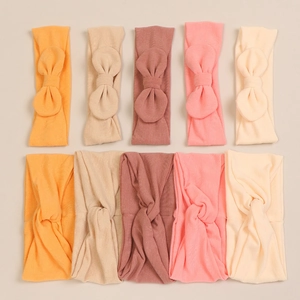 Detailed set of 10 soft modal baby headbands with large bows and twisted knot designs