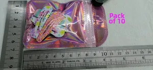 Set of 10 colorful metal BB hair clips with floral and heart patterns in laser bag packaging