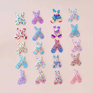 Flat lay set of 40 colorful metal BB hair clips for girls with mixed cartoon patterns