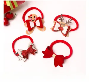 Detail of baby Christmas headbands with gingerbread man, reindeer and velvet bows