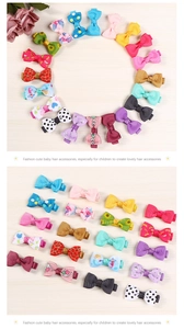 Detailed close-up of colorful grosgrain ribbon bow hair clips with polka dots and patterns