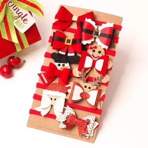 10-piece Christmas baby nylon headbands with Santa, elk, and bow motifs on display card