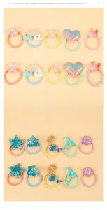 Macro shot of assorted colorful resin charms like hearts and stars on kids hair ties
