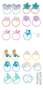 Detail of 2.5cm elastic hair ties for kids with rainbow crowns and soft safety fabric pads