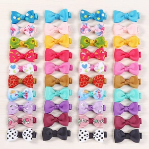 Set of 40 colorful grosgrain ribbon bow hair clips with floral and polka dot patterns