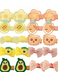 Assorted handmade fabric hair clips featuring cute flower, pineapple, and animal embroidery