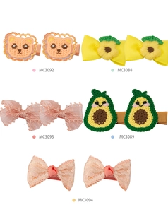 Detailed set of cute fabric hair clips featuring lion embroidery and lace bow designs