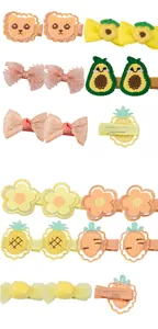 Detailed close-up of 3.5cm handmade fabric hair clips with embroidered animals and flowers