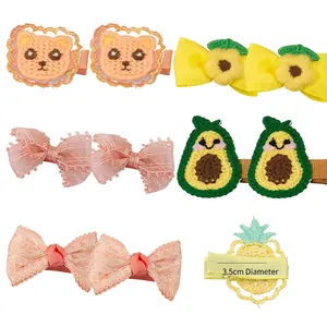 Set of 6 cute handmade fabric hair clips for kids featuring embroidery and floral bows