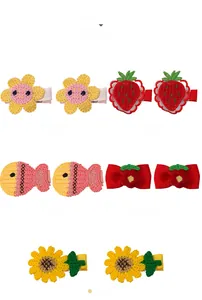 Detailed knit hair clips for kids featuring sunflower, strawberry and floral patterns