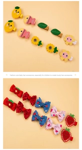 Detail showing colorful crochet and fabric hair clips with floral and animal motifs