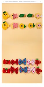 Close-up of knit and fabric hair clips for kids featuring lemon fish and flower designs