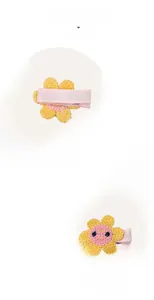Detail show of hand-knit flower hair clip with non-slip fabric padding for children