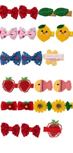 Detail view of 3.5cm knitted hair clips featuring embroidered flowers and cute fruits
