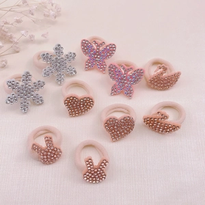 Detail of 10-piece girls elastic hair ties set with sparkling animal rhinestone pendants