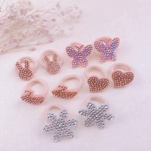 Pink rhinestone elastic hair ties with butterfly, rabbit, and swan motifs for girls