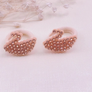 Close-up of pink swan rhinestone hair bands with high-elastic fabric for girls