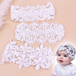 White lace flower headbands for baby girls featuring elastic hollow floral bows