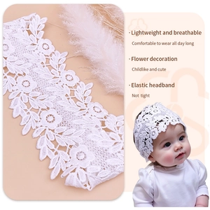 Macro detail of white lace flower headband and elastic baby hair accessory on model