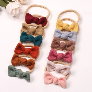 Detailed set of 12 colorful waffle fabric baby headbands with elastic nylon bands