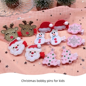 Set of 10 festive Christmas hair clips for kids featuring reindeer and snowmen designs