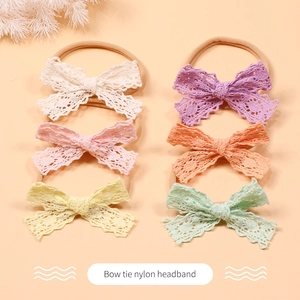 Detail view of 6-piece baby lace bow headbands in candy colors made of soft nylon fabric