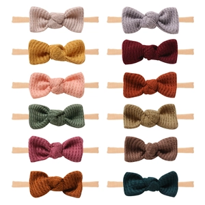 Set of 12 waffle knit baby bow headbands with soft nylon bands in diverse colors