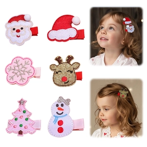 Detail of Christmas hair clips for kids showing Santa, reindeer, and tree designs on models