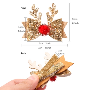 Barrettes bois de renne dorées avec pompon rouge et dimensions détaillées du produit