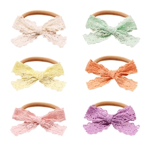 6-pack of baby nylon headbands with delicate hollow lace bows in assorted candy colors